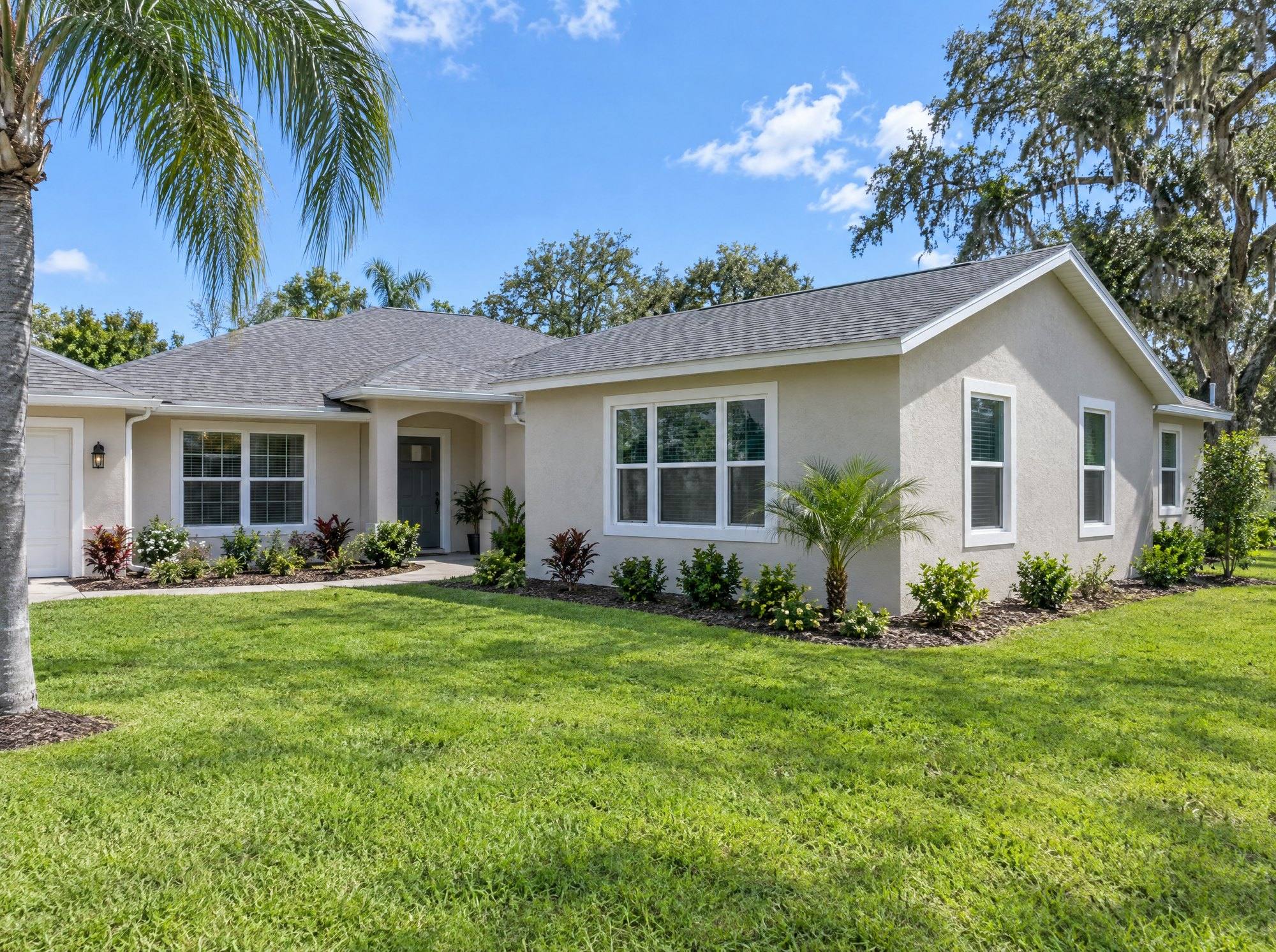 Stucco home in Oviedo with a new primary suite addition on the side